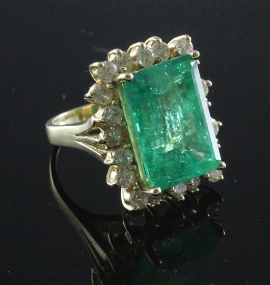 A large 14ct gold emerald and diamond rectangular cluster ring, size M